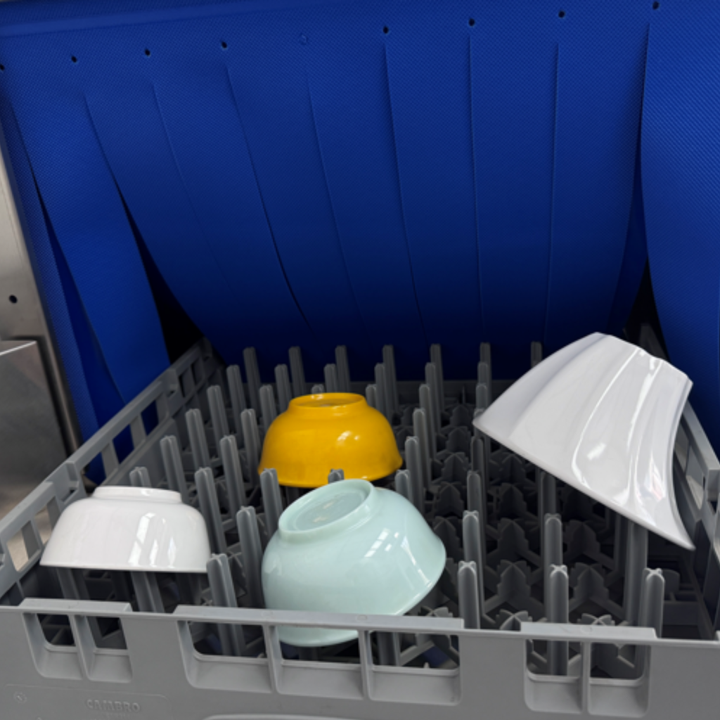 Commercial conveyor dishwasher washing rack with plates, bowls and cups